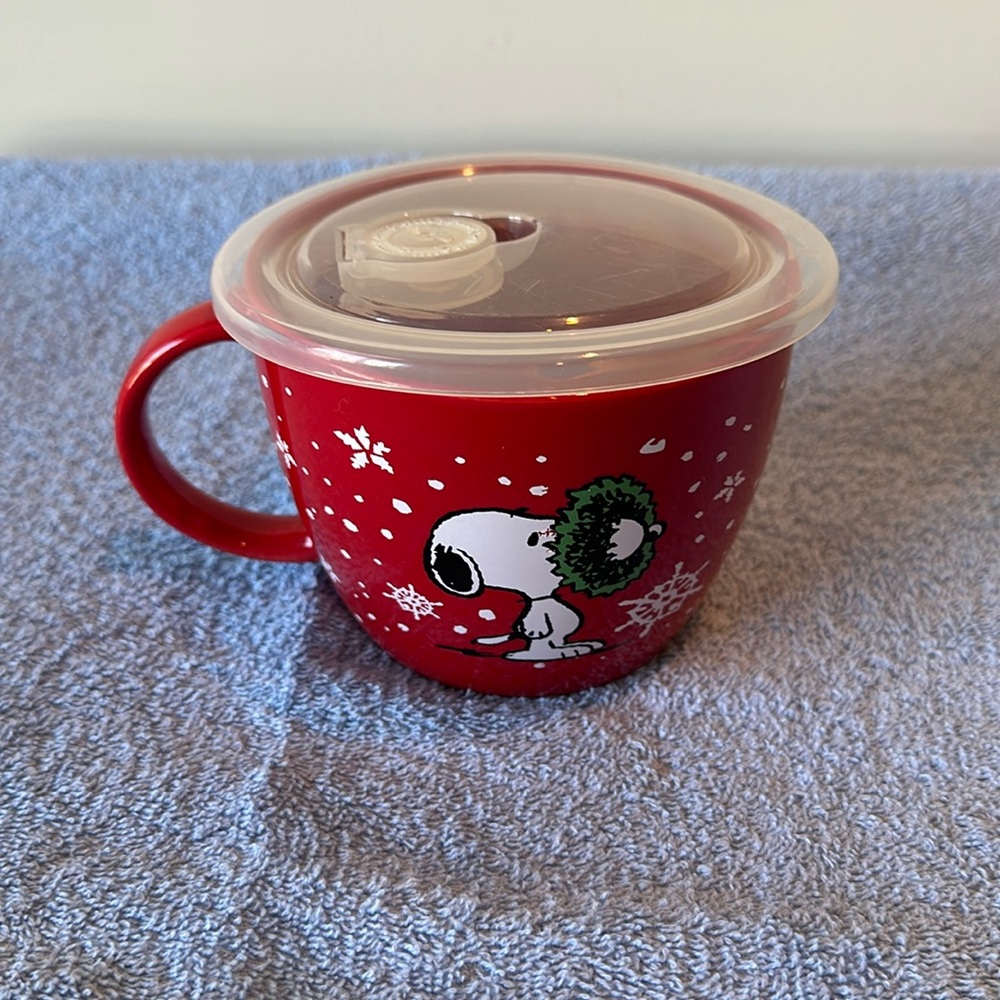 Peanuts soup container, or oversized coffee cup.